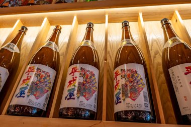 Shanghai, China - April 29 2025  Japanese rice wine bottles arranged on shelves