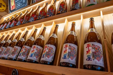 Shanghai, China - April 29 2025  Japanese rice wine bottles arranged on shelves