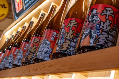 Shanghai, China - April 29 2025  Japanese rice wine bottles arranged on shelves