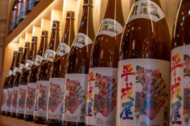 Shanghai, China - April 29 2025  Japanese rice wine bottles arranged on shelves