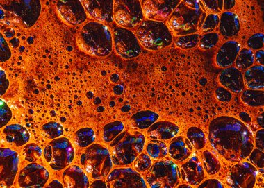 reflections in air bubbles in coffee foam