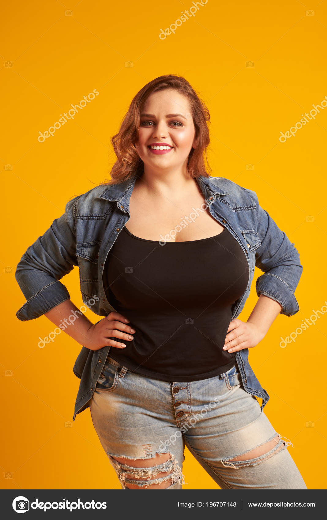 Beautiful plus-size model with big breast smiling at camera Stock by ©konstantynov 196707148