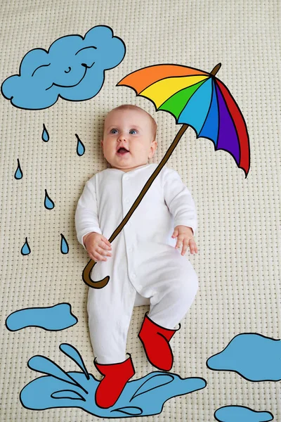 Bébé avec parapluie et concept de pluie — Photo