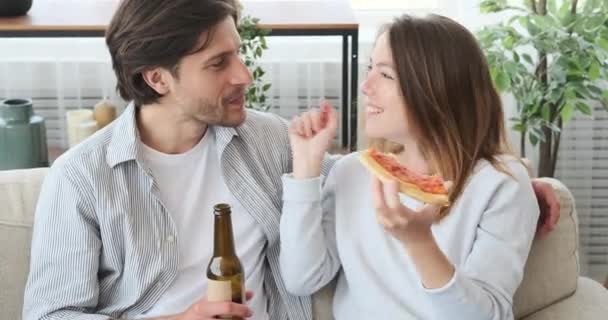 Couple spending leisure time having food and drink at home — Stock Video