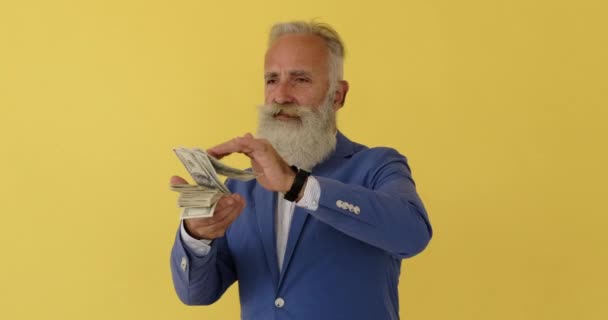 Wealthy businessman throwing money in air — Stock Video