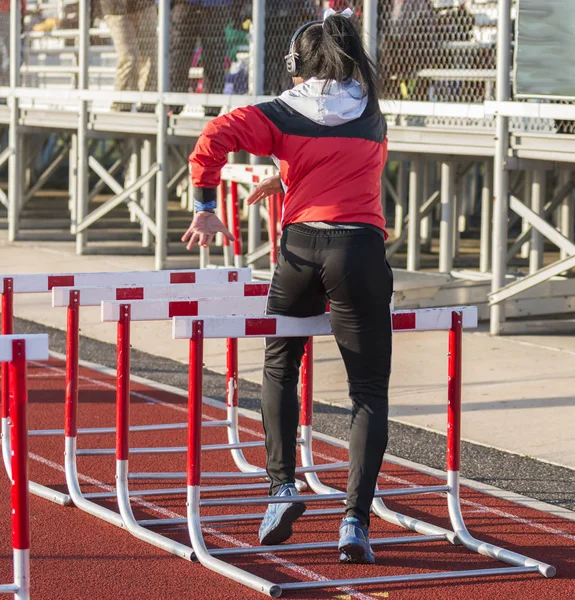 High School Girl Warming Hurdle Race Performing Hurdle Walk Drills — Stock Photo, Image