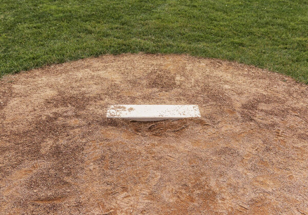 A baseball fields pitchers mound close up.