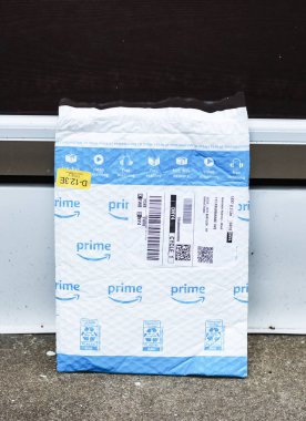 Amazon prime package left exposed at front door clipart