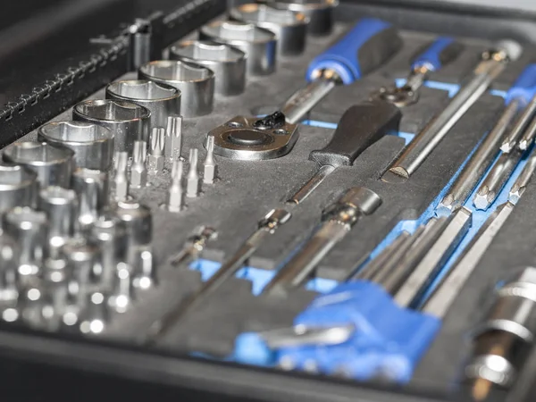 Closeup top view of set metallic tools kit, home workshop garage concept