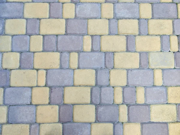 Background of paving tiles laid on the ground