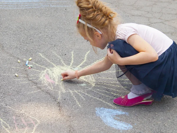 Vinnitsa, Ukraine. 08. 24. 2019. Children draw on the pavement with chalk. Stock Photo