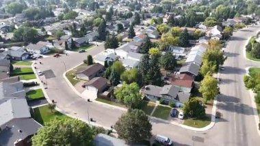 4K aerial view of Parkridge in Saskatoon, highlighting family homes, parks, schools, and residential streets in this westside community.