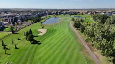 Aerial footage of Greenbryre in 4K, showcasing fairways, ponds, and elegant residences in this prestigious development.