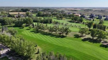 Aerial footage of Greenbryre in 4K, showcasing fairways, ponds, and elegant residences in this prestigious development.