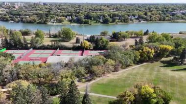 4K aerial view of King George in Saskatoon, showing homes, schools, parks, and its riverside location near the South Saskatchewan River.