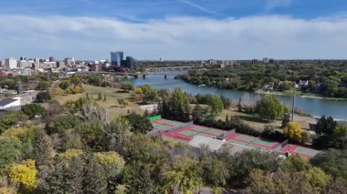 4K aerial view of King George in Saskatoon, showing homes, schools, parks, and its riverside location near the South Saskatchewan River.
