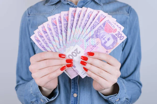 Give bill tax credit interest pawnshop broker investor investment people person debt economy concept. Cropped close up photo of lady\'s hands with red manicure nails holding money isolated  background