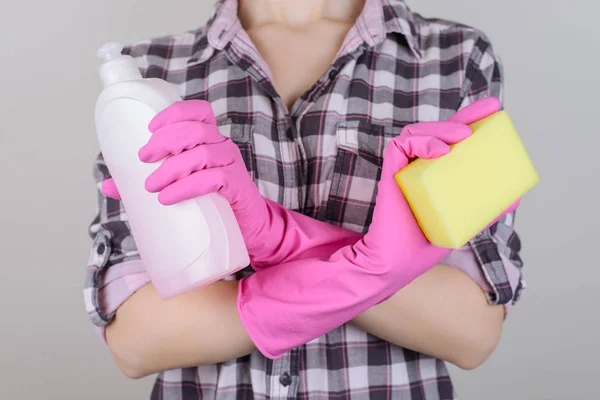 Lifestyle casual checkered shirt people person help family concept. Close up photo of lady\'s hands crossing hands holding bottle yellow sponge isolated on gray background copy-space