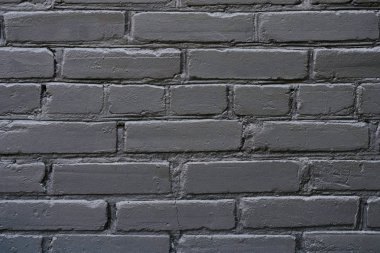 Dokulu koyu siyah modern tarzı trendy şık tuğla duvar arka plan boşaltmak ayrıntılı görünüm fotoğrafını ekrana kapatın