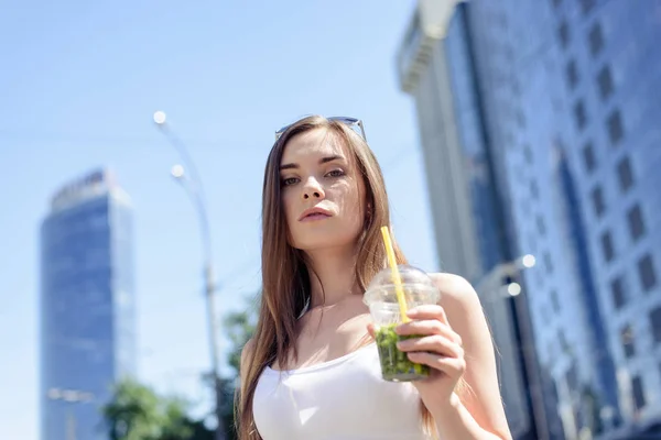 Hot weather rich wealthy life concept. Low angle view photo portrait of pretty attractive confident sexy lady holding plastic mug in hand