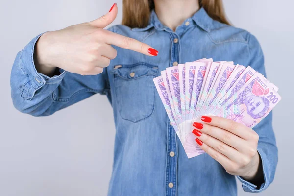 Give bill tax credit interest pawnshop earn atm investor investment people person debt economy concept. Cropped close up photo of lady\'s hands with red manicure nail holding money isolated  background