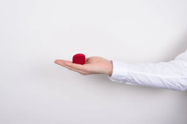 Side Profile Closeup Cropped Photo Hand Holding Closed Red Heart — 스톡 사진