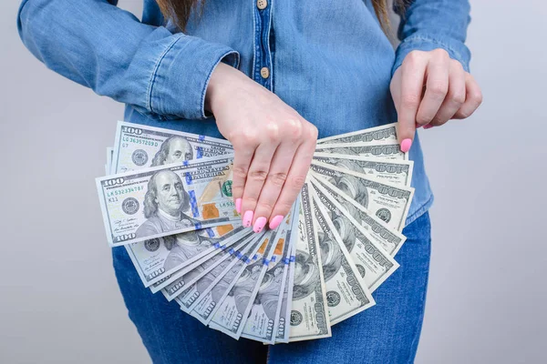 Closeup cropped photo of she her lady closing covering intimate zone using holding pile of money wearing like skirt clothes isolated grey background