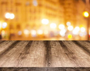 Wooden empty table board in front of blurred background. Can be used for display or montage any product. Mock up for display your product. clipart