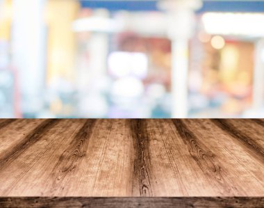 Wooden empty table board in front of blurred background. Can be used for display or montage any product. Mock up for display your product. clipart