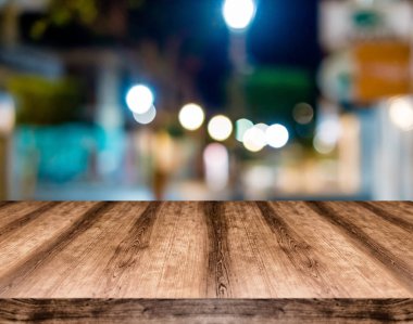 Wooden empty table board in front of blurred background. Can be used for display or montage any product. Mock up for display your product. clipart