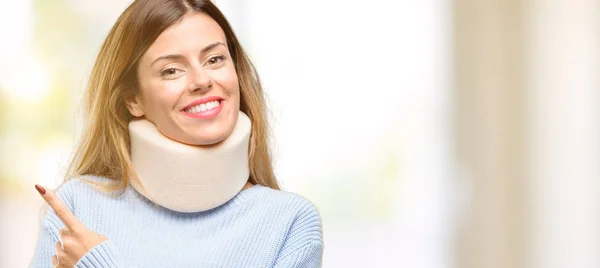 Young Injured Woman Wearing Neck Brace Collar Pointing Away Side — Stock Photo, Image