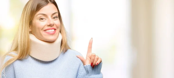 Young Injured Woman Wearing Neck Brace Collar Pointing Away Side — Stock Photo, Image