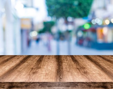 Wooden empty table board in front of blurred background. Can be used for display or montage any product. Mock up for display your product. clipart