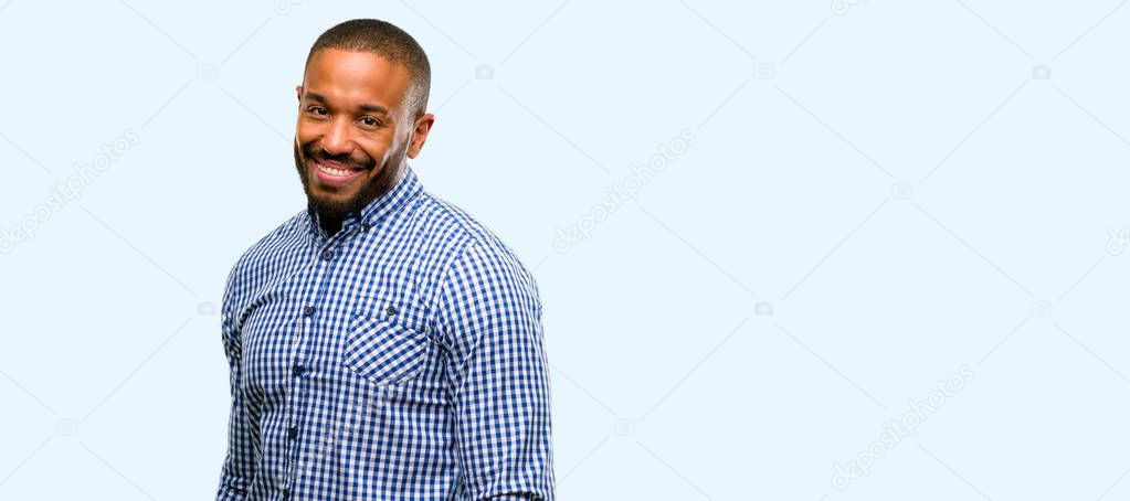 African american man with beard confident and happy with a big natural smile laughing isolated over blue background