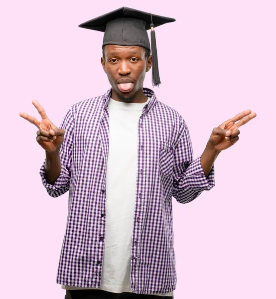 Young African Graduate Student Black Man Looking Camera Showing Tong — Stock Photo, Image