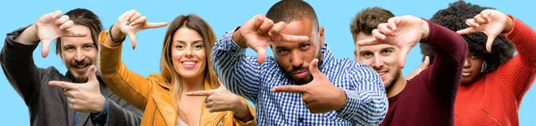 Group of mixed people, women and men confident and happy showing hands to camera, composing and framing gesture