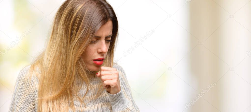 Young beautiful woman sick and coughing, suffering asthma or bronchitis, medicine concept