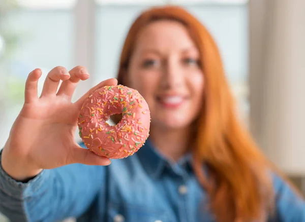 Redhead Woman Holding Donut Home Happy Face Standing Smiling Confident — Stock Photo, Image