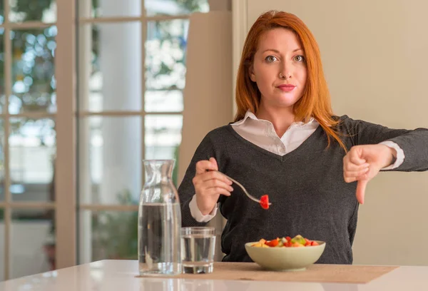 Redhead Woman Eating Fruit Bowl Kiwi Strawberry Home Angry Face — Stock Photo, Image