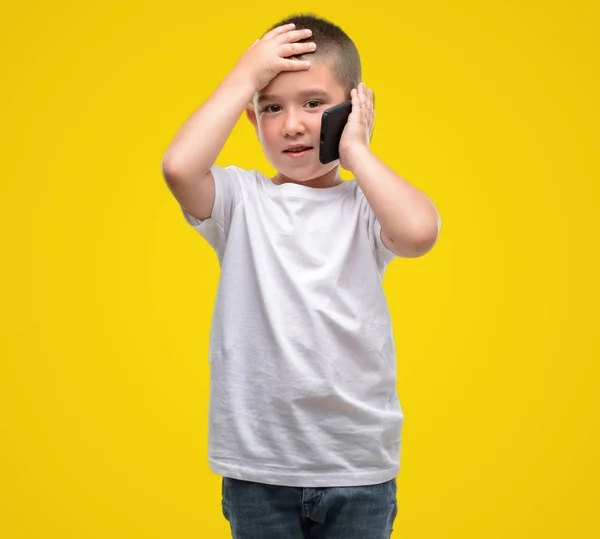 Dark Haired Little Child Using Smartphone Stressed Hand Head Shocked — Stock Photo, Image