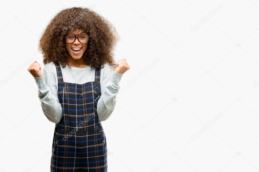 African american woman wearing a retro style screaming proud and celebrating victory and success very excited, cheering emotion