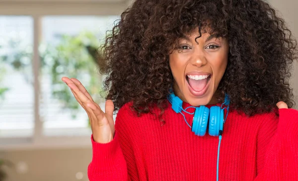 African American Woman Wearing Headphones Celebrating Crazy Amazed Success Arms — Stock Photo, Image