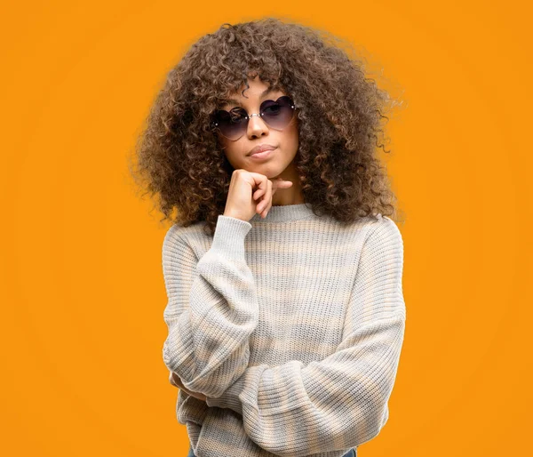 African American Woman Wearing Stripes Sweater Serious Face Thinking Question — Stock Photo, Image