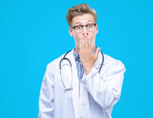 Young Handsome Blond Doctor Cover Mouth Hand Shocked Shame Mistake — Stock Photo, Image