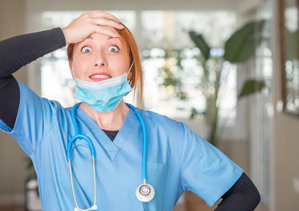Medical professional woman with stethoscope stressed with hand on head, shocked with shame and surprise face, angry and frustrated. Fear and upset for mistake.