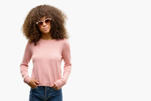 African American Woman Wearing Pink Sunglasses Smiling Looking Side Staring — Stock Photo, Image