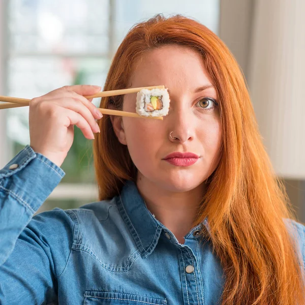 Redhead Woman Eating Sushi Using Chopsticks Confident Expression Smart Face — Stock Photo, Image