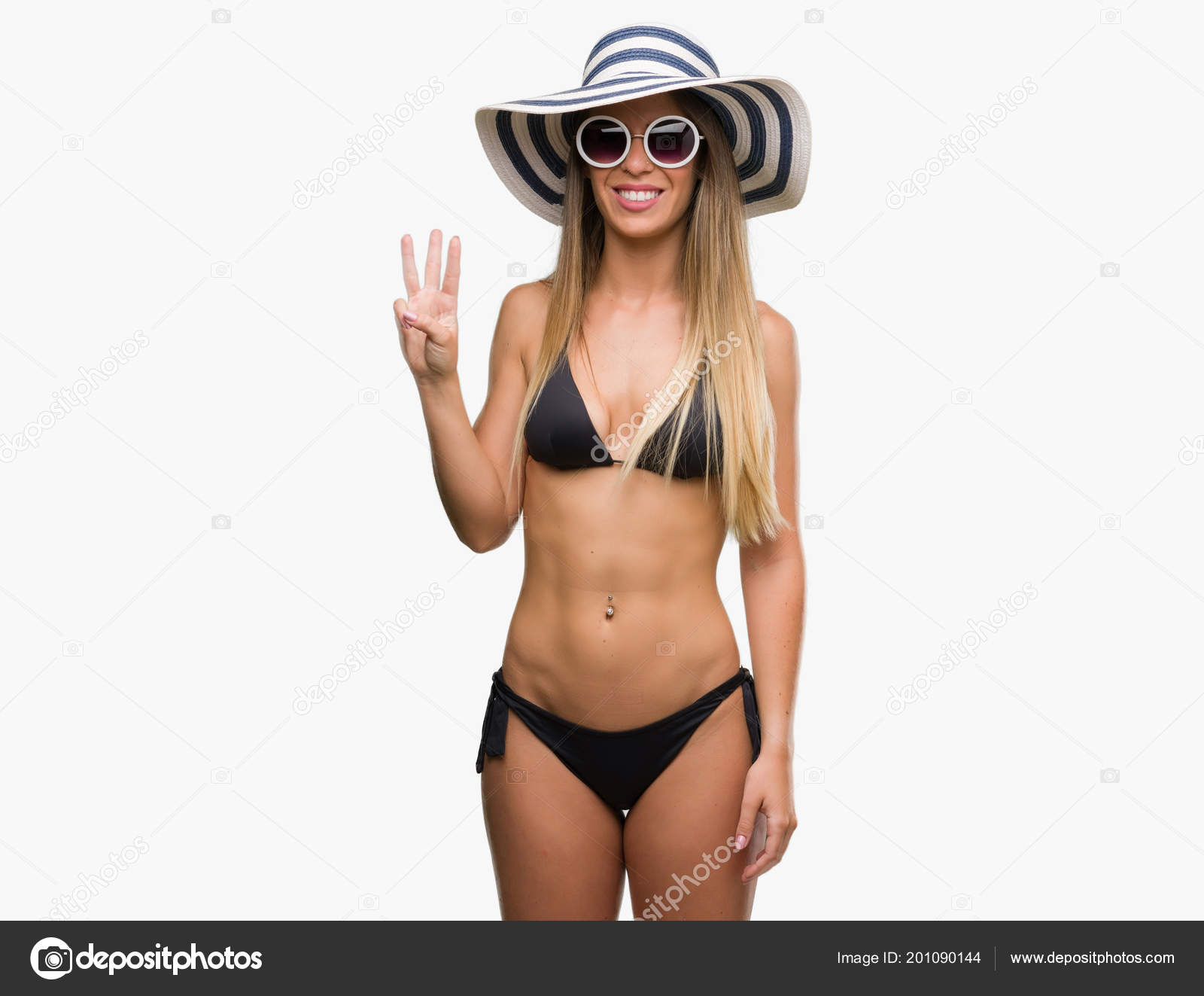 Young girl fingering bikini picture