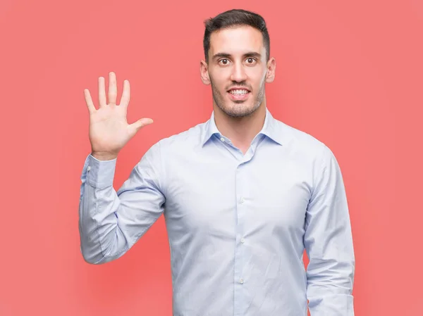 Handsome Young Businessman Showing Pointing Fingers Number Five While Smiling — Stock Photo, Image