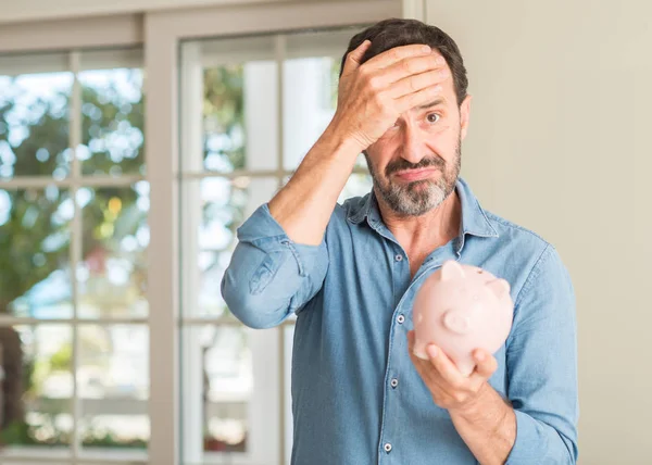 Middle Age Man Money Piggy Bank Stressed Hand Head Shocked — Stock Photo, Image